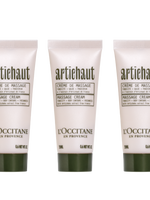 Three tubes of L'Occitane en Provence Artichoke Body Massage Cream, 20ml each, with green caps and labels indicating the cream is enriched with shea butter and apricot oil.
