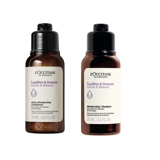 Two L'Occitane hair care bottles on a white background