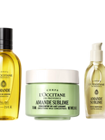 L'Occitane skincare products including a shower gel, milk, and oil on a white background